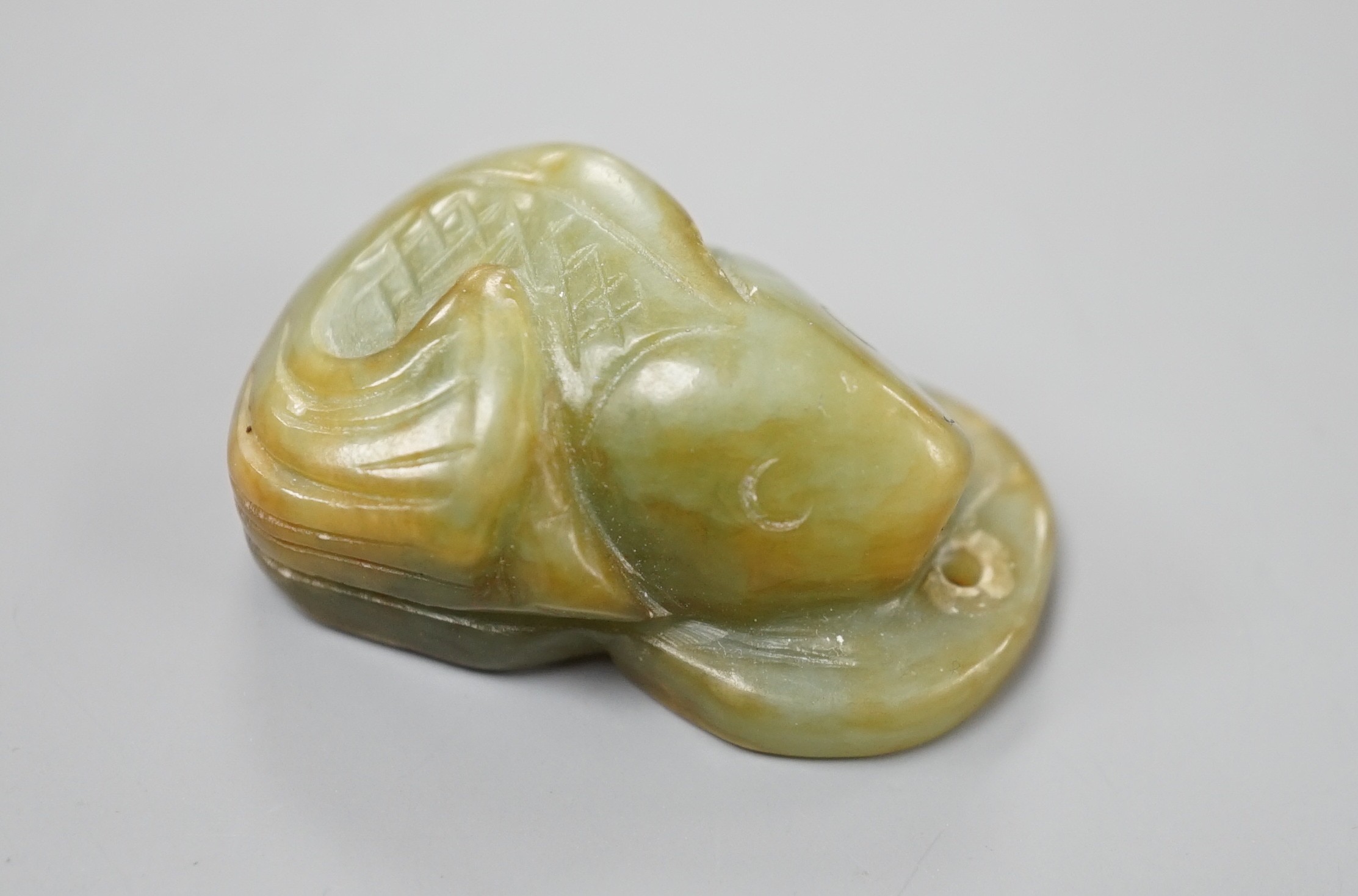 A Chinese jade fish and cash pendant, 3.4cm